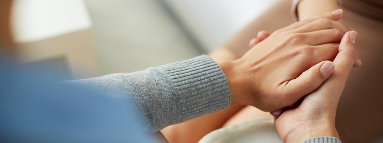 Two people holding hands