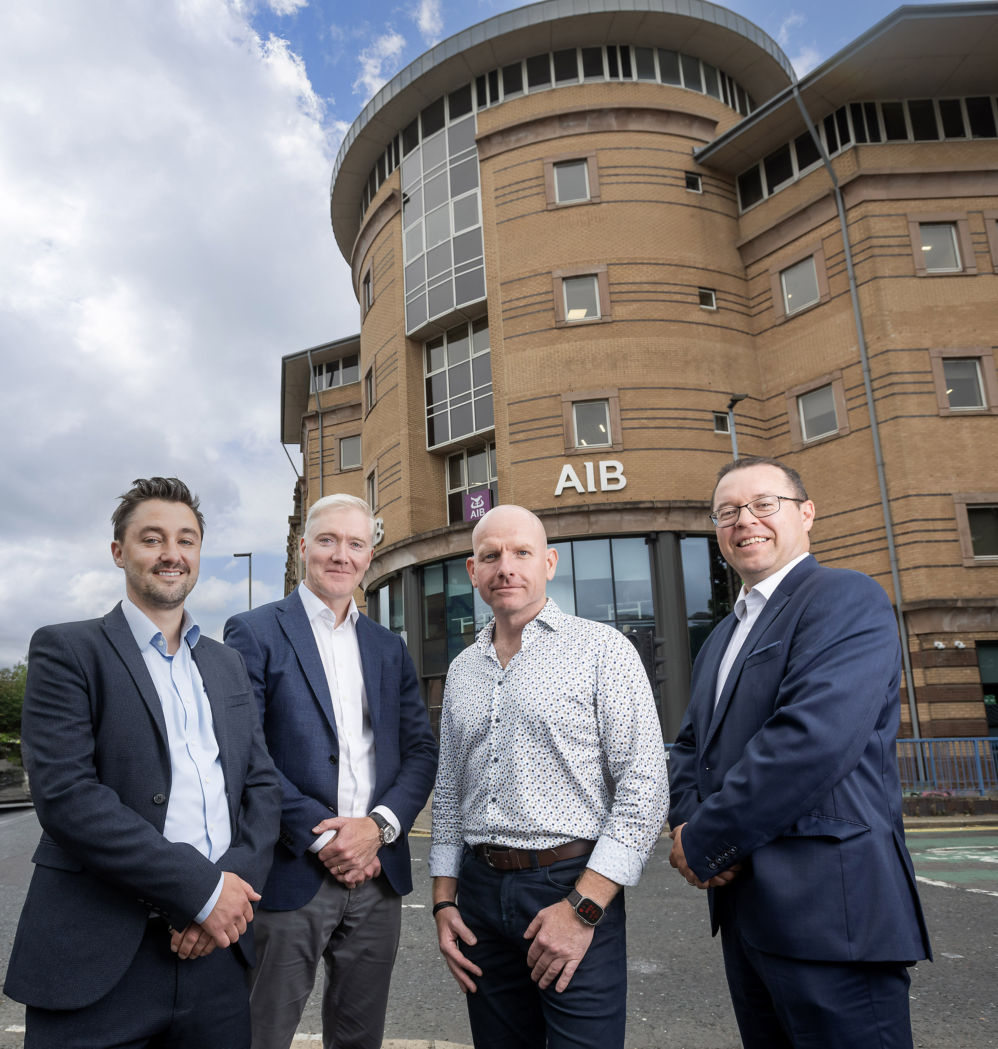 two people holding co-ownership sign